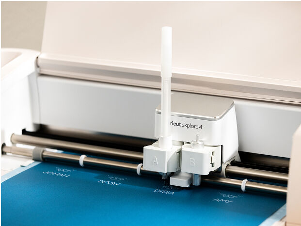 Cricut Explore 3 smart cutting machine cutting blue vinyl